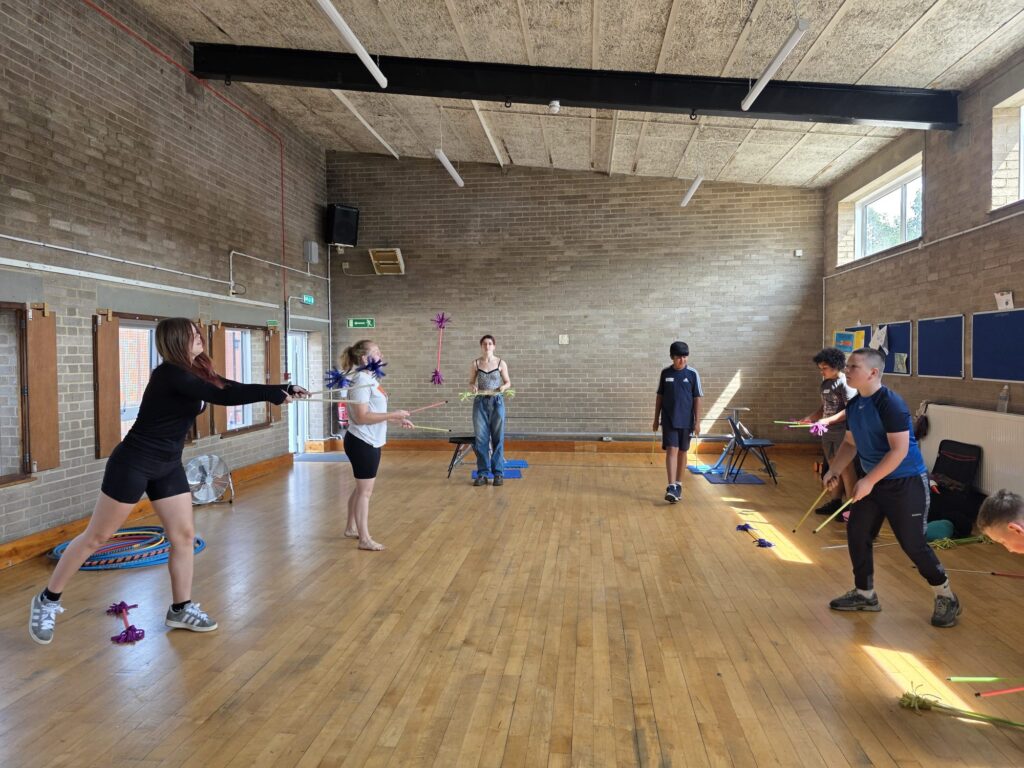 children doing activities in a sports hall