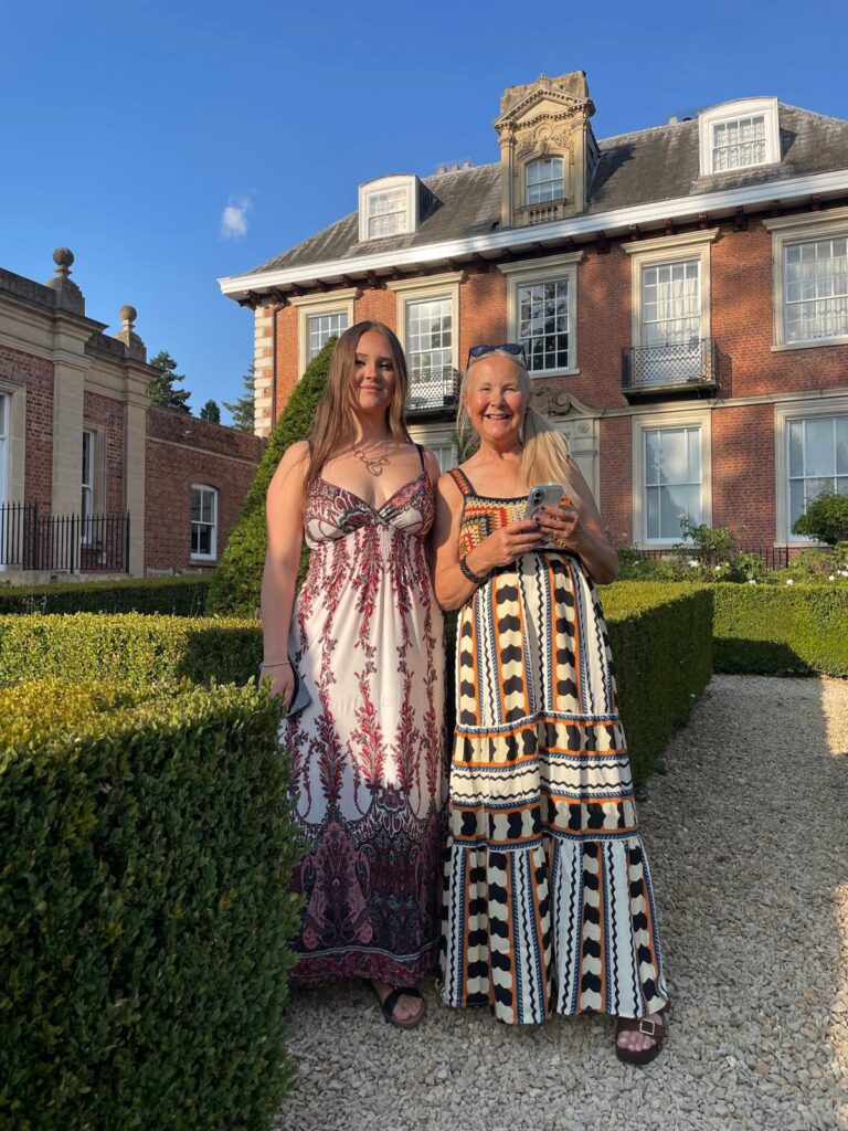 girl and her mum in a garden