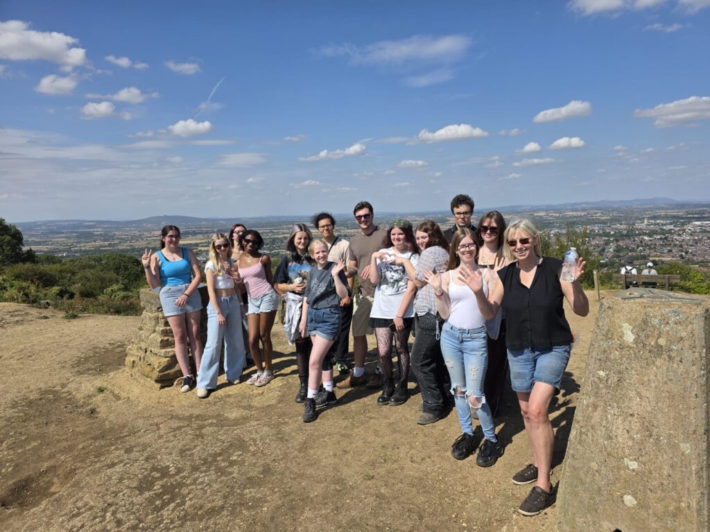 group of young people and care workers in a hill